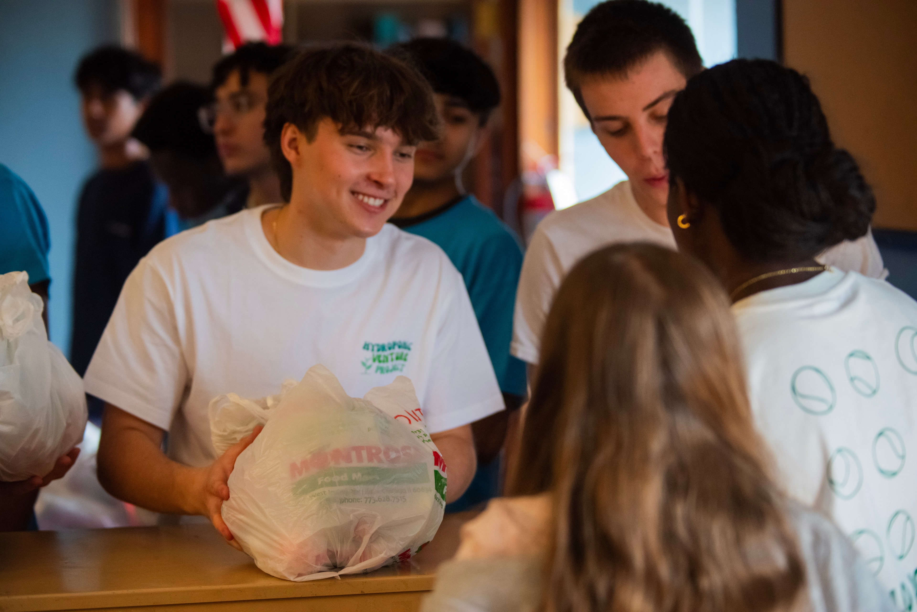 Family distribution event following a classroom harvest.