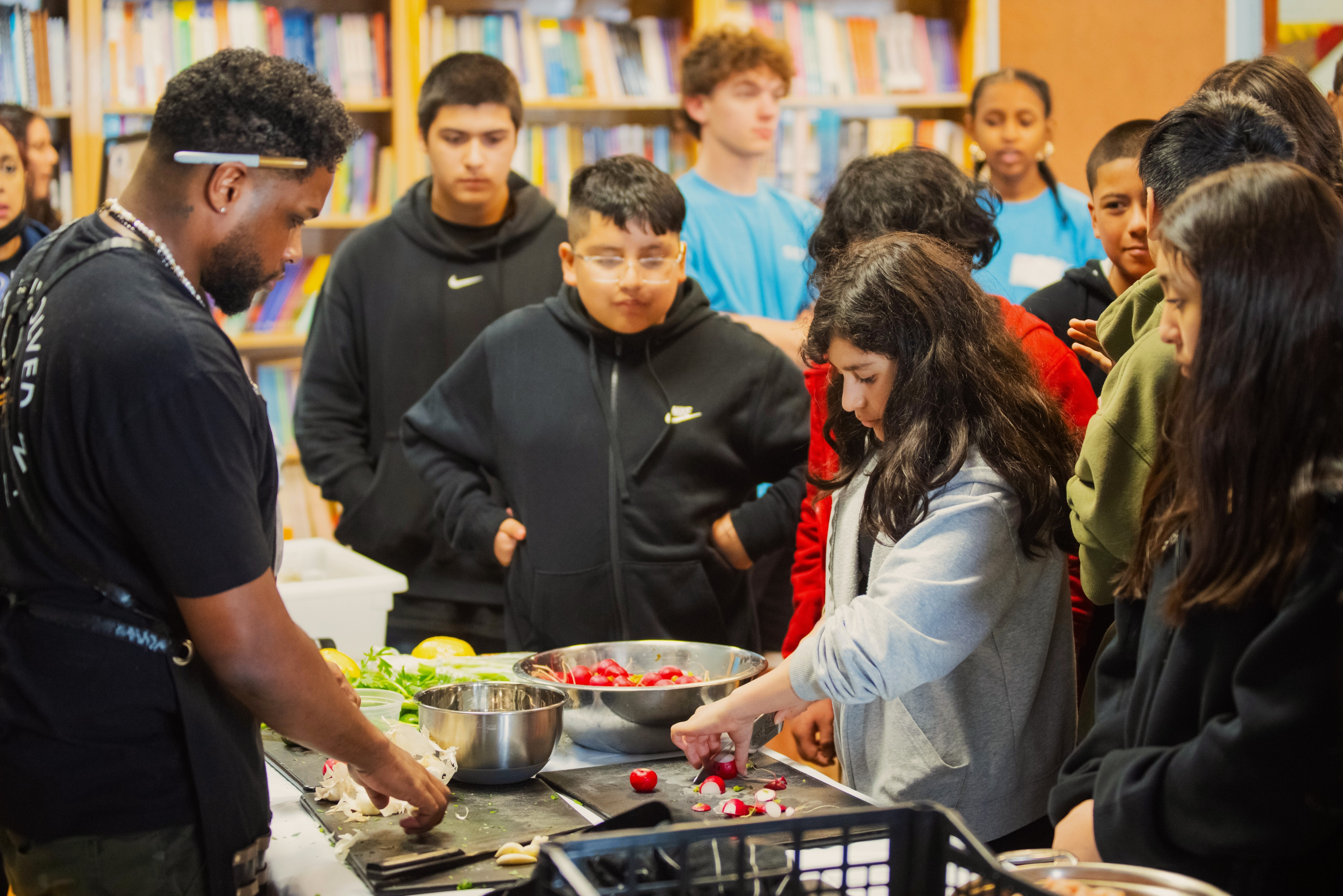 Talcott students cutting produce they grew during a culinary workshop.