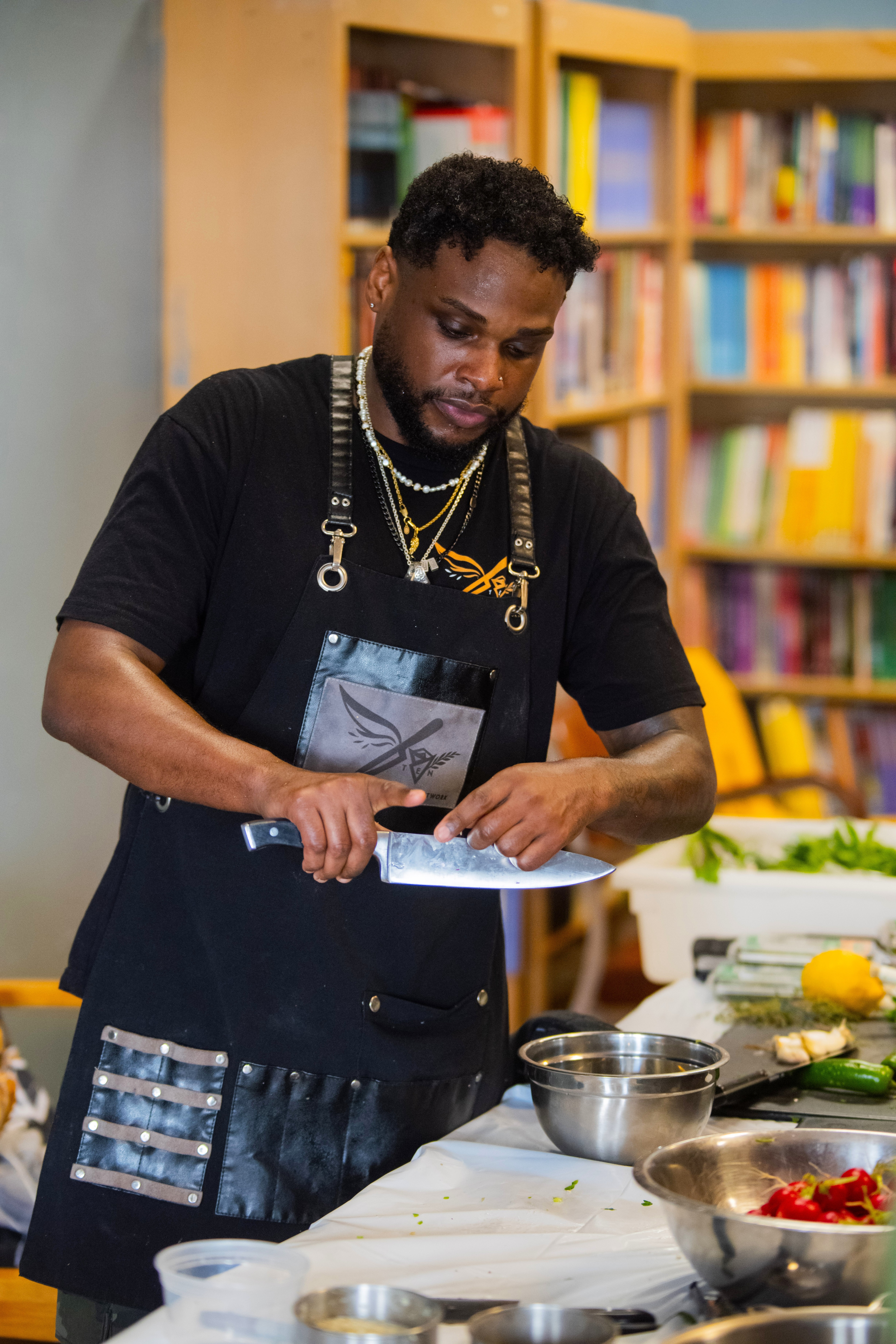Chef Sebastian White demonstrating knife skills.