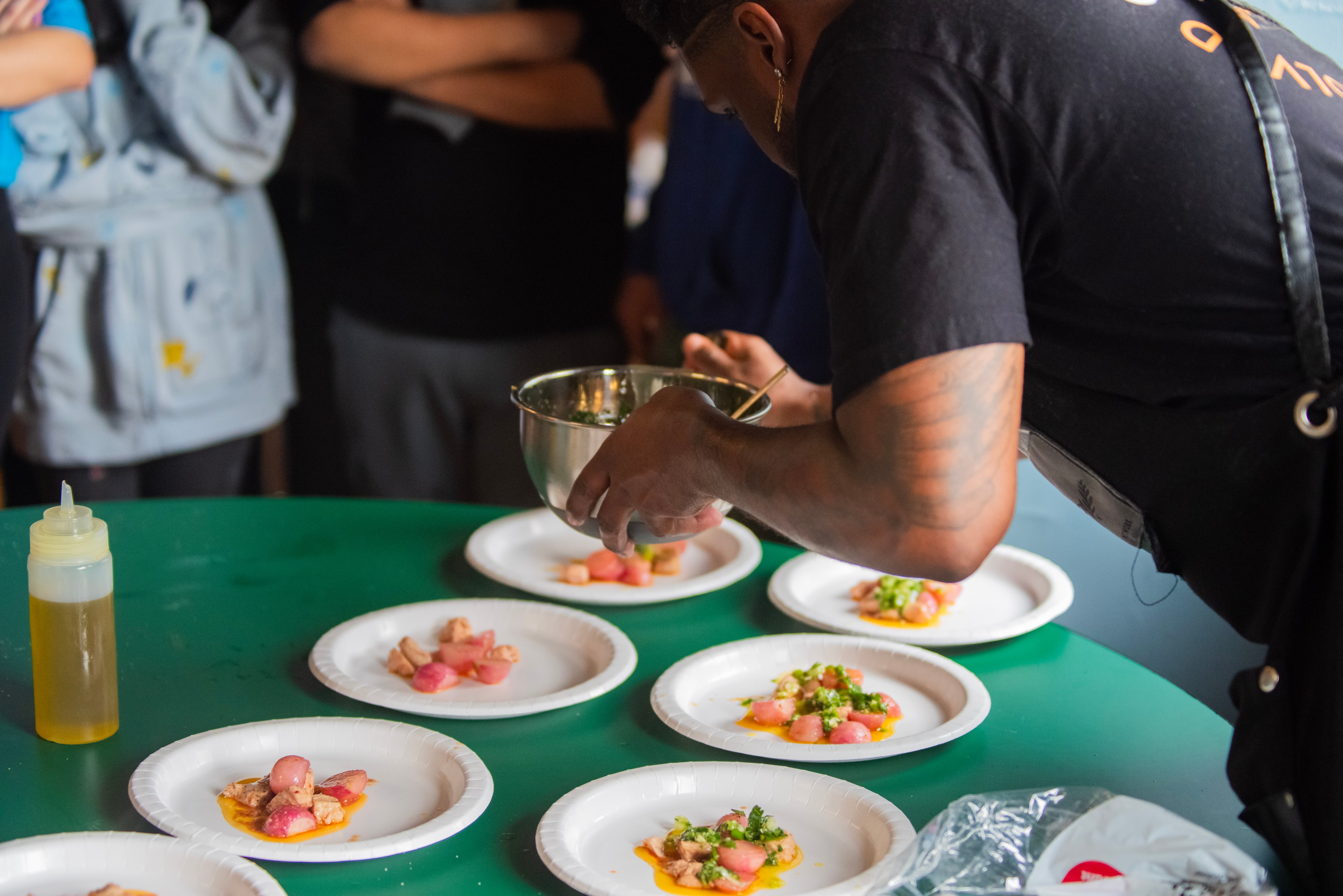 Chef plating the finished dish at Talcott.
