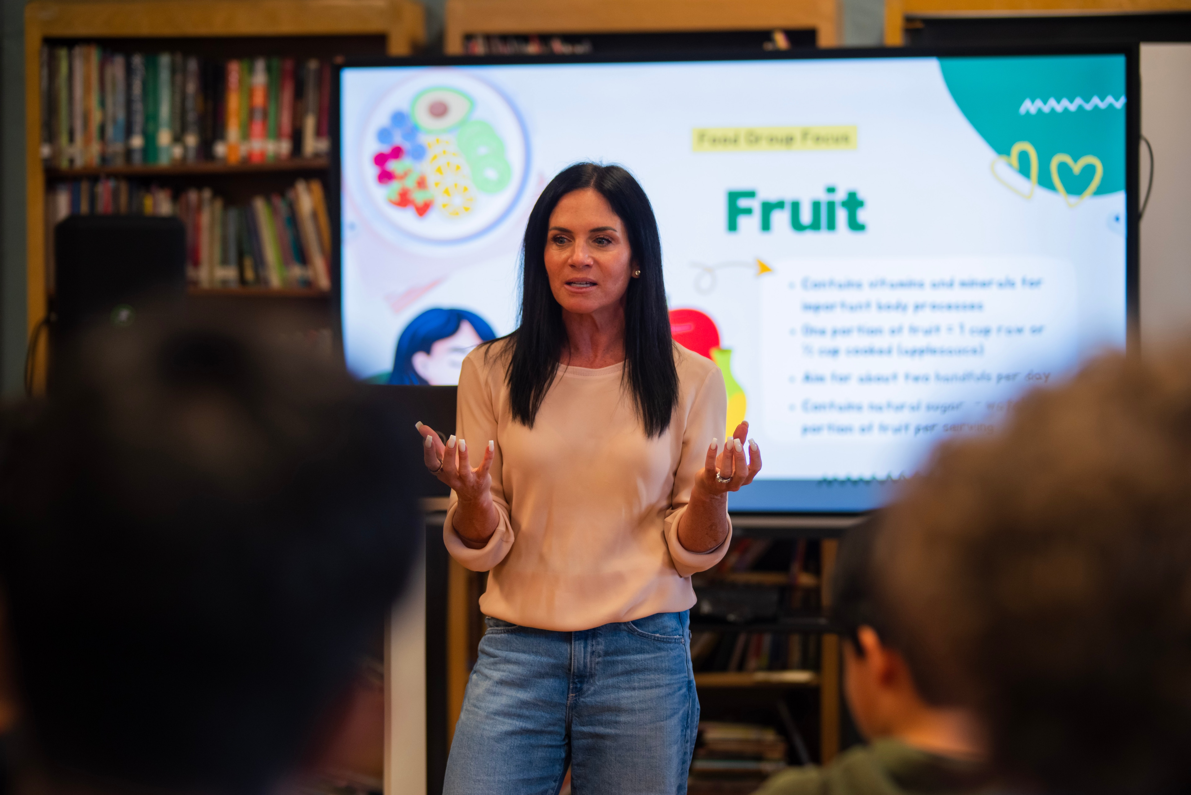 Nutritionist leading a fruit-group lesson at Talcott Elementary.